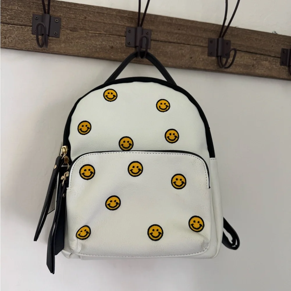 đ Violet Ray Smiley Face Embroidered Mini Backpack NWT - Picture 1 of 6